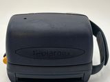 an image of a black and yellow toaster sitting on top of a white table