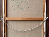 an old picture frame with a message written on it in a room