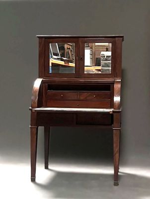 a piano and a mirror on a table in a room