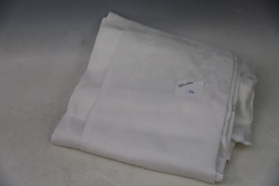 a stack of white napkins sitting on top of a table