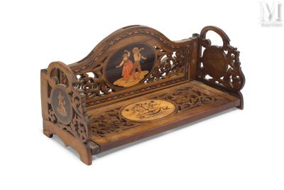 a wooden bench with a picture of a man and a woman on it