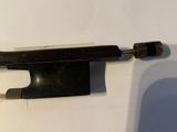 a knife that is laying on top of a piece of paper