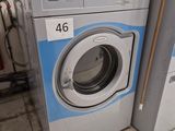 a washing machine and a dryer sitting next to each other