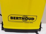 a close up of a yellow bench with a sign on it