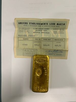 an image of a piece of gold sitting on top of a piece of paper