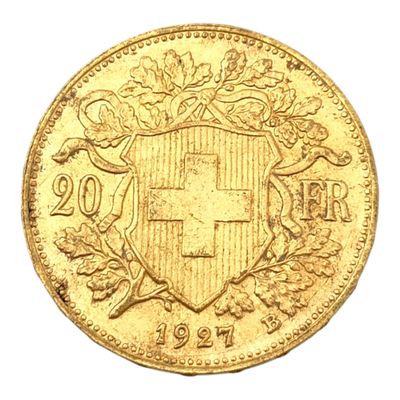 gros plan d'une pièce d'or portant des armoiries
