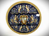 a blue plate with gold and blue designs on it