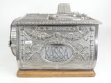 an old fashioned metal cash register with a wooden base