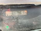 a close up of a clock on the back of a car