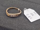 a close up of a ring with a price tag next to it