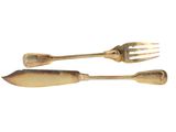two forks and spoons are sitting on a white surface