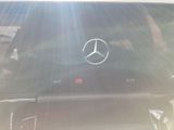 someone is taking a picture of a car with a mercedes logo on the screen