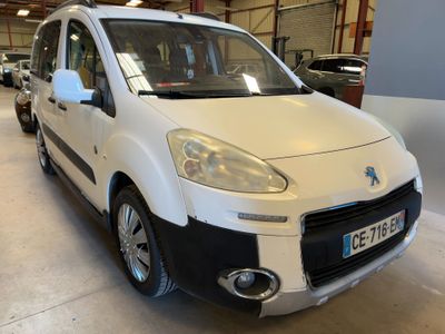 the small white van is parked in the garage of a building