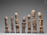 a group of five wooden figures of different sizes and shapes