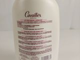 a bottle of body lotion sitting on a table
