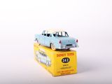 a blue toy car sitting on top of a yellow box