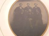 an old photo of a group of men standing together