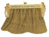 a gold chain purse with a chain handle