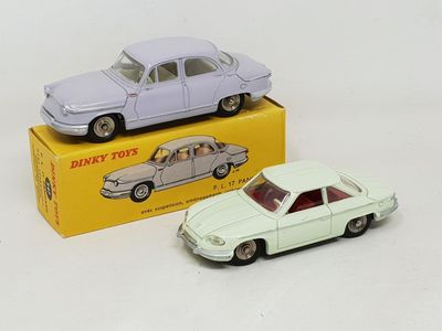 two toy cars sitting next to each other on a table