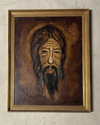 une peinture représentant un homme barbu accrochée au mur