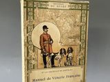 an old book with a picture of a man and two dogs
