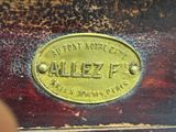 a close up of a brass plate with a name on it