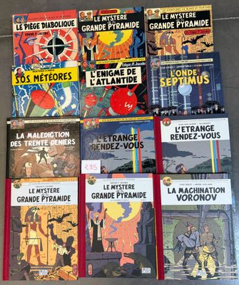 several books are stacked on top of each other on a table