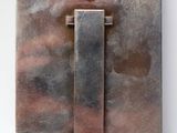 a close up of a metal door handle on a wall