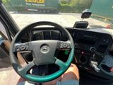 someone is driving a truck with a steering wheel on the road