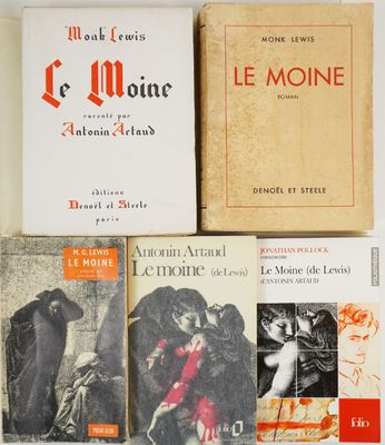 several books are stacked on top of each other on a table