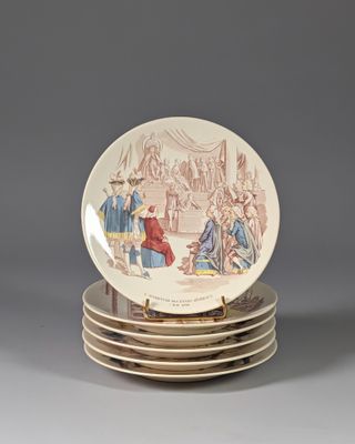 several plates are stacked on top of each other on a table