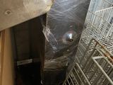 an image of a metal cage with a door open