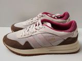 a close up of a pair of sneakers on a table