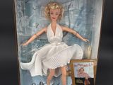 marilyn monroe doll in a box with a picture on it