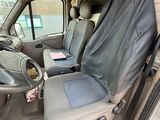 the interior of a van with the seat covers folded down