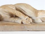 marble sculpture of a man and a woman laying on a marble base