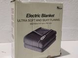an electric blanket in the box on the table