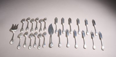 a lot of forks and spoons on the table