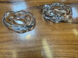 two glass ashtrays on a wooden table
