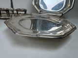 a silver tray with a mirror on it and a candle holder