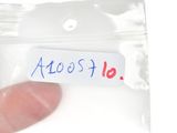 a person holding a plastic bag with a sticker on it