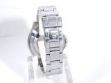 a close up of a watch on display on a white surface