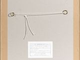 an old picture of a pair of scissors hanging from a rope