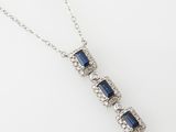 a sapphire and diamond pendant on a chain