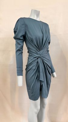 the mannequin is wearing a gray dress with a knot around the waist