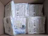 several rolls of toilet paper in a cardboard box on top of a table