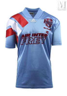 a blue shirt with a red and white stripe on the chest