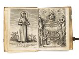 un vieux livre sur lequel figure l'image d'un homme tenant une croix et un livre sur lequel figure l'image d'un homme tenant une croix