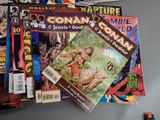 a lot of comic books sitting on a table