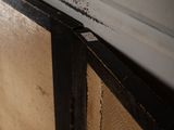 a close up of a window with a wooden frame
